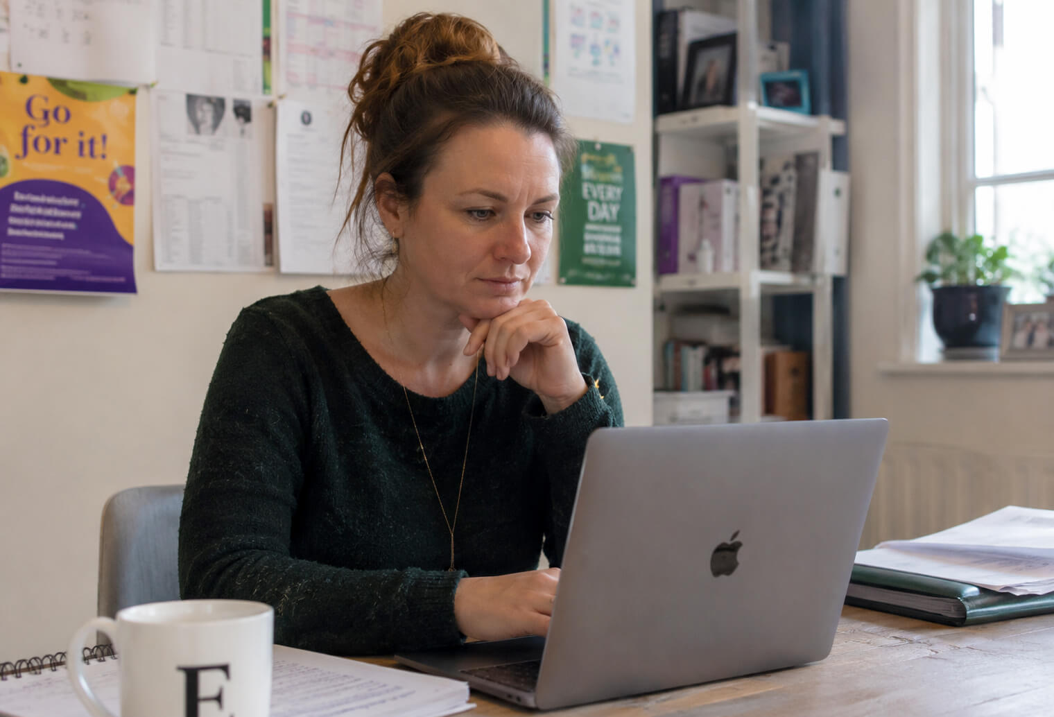 Teacher looking at their laptop
